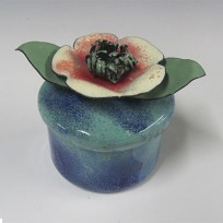 Small  Glass Enamel vessel with flower light blue green and cream